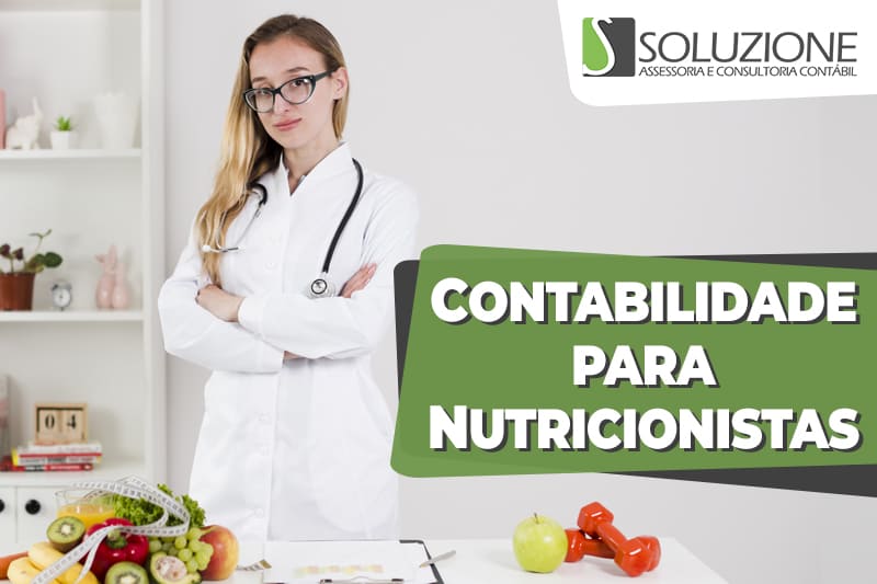 Contabilidade para nutricionistas - imagem de nutricionista de jaleco branco e estetoscópio com uma mesa cheia de frutas, legumes e verduras